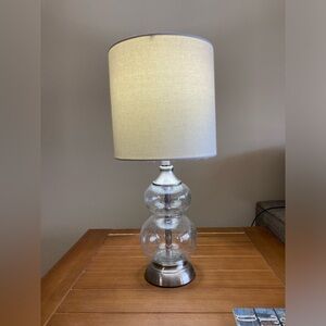 Glass lamp with white shade.  Glass fillable.